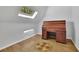 Attic space featuring hardwood floors, a skylight, and a classic roll-top desk at 5004 Barnwood Nw Ter, Kennesaw, GA 30152