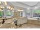 Bright bathroom featuring double vanities, stained glass windows, and a luxurious soaking tub at 5004 Barnwood Nw Ter, Kennesaw, GA 30152