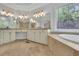 Bathroom showcasing granite counters, tile floors, stained glass windows, and double sinks at 5004 Barnwood Nw Ter, Kennesaw, GA 30152