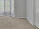 Neutral bedroom showcasing a bay window and carpet at 5004 Barnwood Nw Ter, Kennesaw, GA 30152