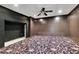 A bonus room features a unique carpet, modern ceiling fan, and recessed lighting at 5004 Barnwood Nw Ter, Kennesaw, GA 30152