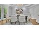 The dining room showcases hard wood floors and modern decor with views of the lush green outdoors at 5004 Barnwood Nw Ter, Kennesaw, GA 30152