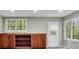 A living room with built-in shelving and windows provide natural lighting at 5004 Barnwood Nw Ter, Kennesaw, GA 30152