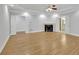 Spacious main bedroom featuring a fireplace, tray ceilings, and hardwood floors at 5004 Barnwood Nw Ter, Kennesaw, GA 30152