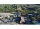 Aerial view showcasing the community, nearby highway, and surrounding woods at 600 Bedfort Dr, Duluth, GA 30096