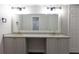 Bathroom featuring double vanity, granite counters, and brushed gold plumbing fixtures at 600 Bedfort Dr, Duluth, GA 30096