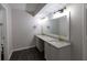 Bathroom featuring double vanity, granite counters, and brushed gold plumbing fixtures at 600 Bedfort Dr, Duluth, GA 30096
