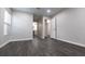 Empty bedroom with a door to the ensuite and a large window for natural light at 600 Bedfort Dr, Duluth, GA 30096