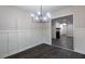 Bright dining room with chair rail detail, modern chandelier, and luxury vinyl plank flooring at 600 Bedfort Dr, Duluth, GA 30096