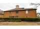 Two-story brick exterior surrounded by lush landscaping at 600 Bedfort Dr, Duluth, GA 30096