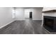 Open concept living room with a fire place, wood floors and lots of light at 600 Bedfort Dr, Duluth, GA 30096