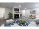 Cozy living room features a modern fireplace, wood floors, and open floor plan at 600 Bedfort Dr, Duluth, GA 30096