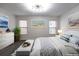 Cozy bedroom with natural light, a comfortable bed, and stylish decor at 600 Bedfort Dr, Duluth, GA 30096