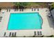 Community pool offers lounge chairs and tables for resident relaxation at 600 Bedfort Dr, Duluth, GA 30096