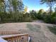 Large backyard with view of trees and wooded surroundings at 7817 Mattie Mccoy Ln, Winston, GA 30187