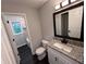 Bathroom featuring a granite vanity and tiled shower at 7817 Mattie Mccoy Ln, Winston, GA 30187