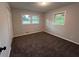 Bedroom featuring neutral carpet and natural light from the windows at 7817 Mattie Mccoy Ln, Winston, GA 30187