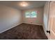 Cozy bedroom with neutral carpet and natural light from a window at 7817 Mattie Mccoy Ln, Winston, GA 30187