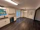 Bright kitchen featuring white cabinets, granite counters, and stainless steel appliances at 7817 Mattie Mccoy Ln, Winston, GA 30187