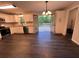 Well-appointed kitchen with white cabinetry, granite counters, and easy access to the deck at 7817 Mattie Mccoy Ln, Winston, GA 30187