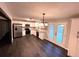 Well-lit kitchen with stainless steel appliances, white cabinets, and backyard view at 7817 Mattie Mccoy Ln, Winston, GA 30187
