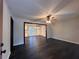 Open-concept living room with sleek floors and seamless flow to the kitchen at 7817 Mattie Mccoy Ln, Winston, GA 30187