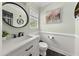 Half bathroom with a white vanity, and updated fixtures at 1165 Evergreen Oak Way, Dacula, GA 30019