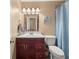 Bathroom with single sink vanity, updated fixtures, and tile flooring at 1165 Evergreen Oak Way, Dacula, GA 30019