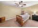 Cozy bedroom featuring a ceiling fan and neutral color palette at 1165 Evergreen Oak Way, Dacula, GA 30019