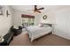 Bright bedroom featuring a ceiling fan and view of the backyard at 1165 Evergreen Oak Way, Dacula, GA 30019