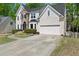 Charming two-story home with a well-maintained lawn, stone accents, and an attached two-car garage at 1165 Evergreen Oak Way, Dacula, GA 30019