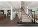 Spacious hallway with hardwood floors, staircase, and access to multiple rooms at 1165 Evergreen Oak Way, Dacula, GA 30019