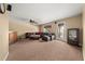 Spacious living room with plush seating, ceiling fan, and backyard access at 1165 Evergreen Oak Way, Dacula, GA 30019