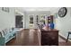 Bright home office with hardwood floors, a large desk, and plenty of natural light at 1165 Evergreen Oak Way, Dacula, GA 30019