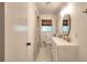 Bathroom featuring a double vanity, mosaic tile flooring, and natural light at 1531 Cooper Lake Se Rd, Smyrna, GA 30082