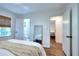 Bright bedroom with hardwood floors, a window with blinds, and white trim at 1531 Cooper Lake Se Rd, Smyrna, GA 30082