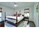 Bright bedroom featuring a four-poster bed, hardwood floors, and natural light at 1531 Cooper Lake Se Rd, Smyrna, GA 30082