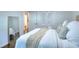 Bright bedroom featuring a large bed with throw blanket and ensuite bathroom at 1531 Cooper Lake Se Rd, Smyrna, GA 30082