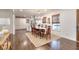 Open concept dining area featuring hardwood floors, a chandelier, and views into the kitchen at 1531 Cooper Lake Se Rd, Smyrna, GA 30082