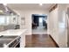 Open kitchen layout with white cabinets, stainless steel appliances, and hardwood floors at 1531 Cooper Lake Se Rd, Smyrna, GA 30082