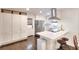 Modern kitchen with stainless steel appliances, white cabinetry, and a breakfast bar at 1531 Cooper Lake Se Rd, Smyrna, GA 30082