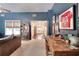 Den features blue accent wall, bookcase and decorative items at 1531 Cooper Lake Se Rd, Smyrna, GA 30082