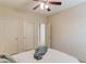 Comfortable bedroom with carpet floors, ceiling fan, and multiple closets at 1691 Scenic Pines Dr, Lawrenceville, GA 30044