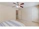 Bedroom features a ceiling fan, neutral paint, carpet, and access to another room at 1691 Scenic Pines Dr, Lawrenceville, GA 30044