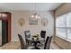 Cozy dining area with a glass table, seating for four, and a modern chandelier at 1691 Scenic Pines Dr, Lawrenceville, GA 30044