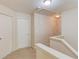 Hallway with two white doors and neutral walls with carpeted floors at 1691 Scenic Pines Dr, Lawrenceville, GA 30044