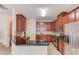 Well-equipped kitchen with stainless steel appliances, granite countertops, and ample cabinet space at 1691 Scenic Pines Dr, Lawrenceville, GA 30044
