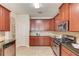 Well-equipped kitchen with stainless steel appliances, granite countertops, and ample cabinet space at 1691 Scenic Pines Dr, Lawrenceville, GA 30044