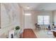 Bright and airy living room with light walls, wood floors, and comfortable seating arrangement at 1691 Scenic Pines Dr, Lawrenceville, GA 30044
