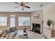 Inviting living room with a fireplace, stylish decor, and ample natural light at 1691 Scenic Pines Dr, Lawrenceville, GA 30044